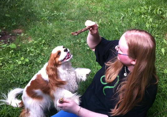 Sam playing with her dog